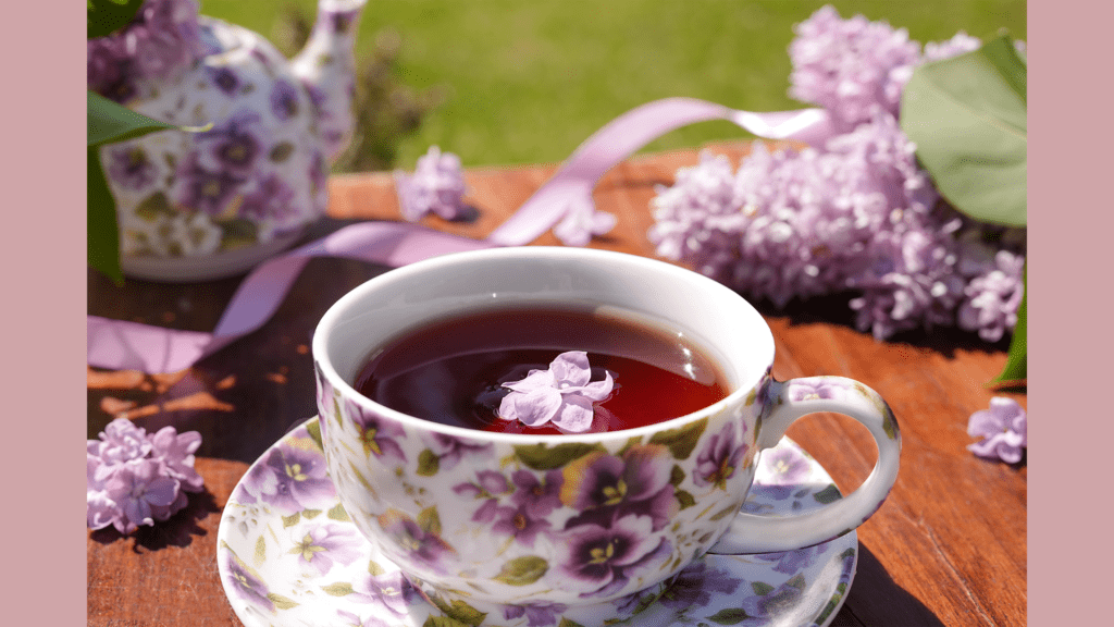 Spring tea party table decorated with flowers for an Ostara spring equinox celebration
